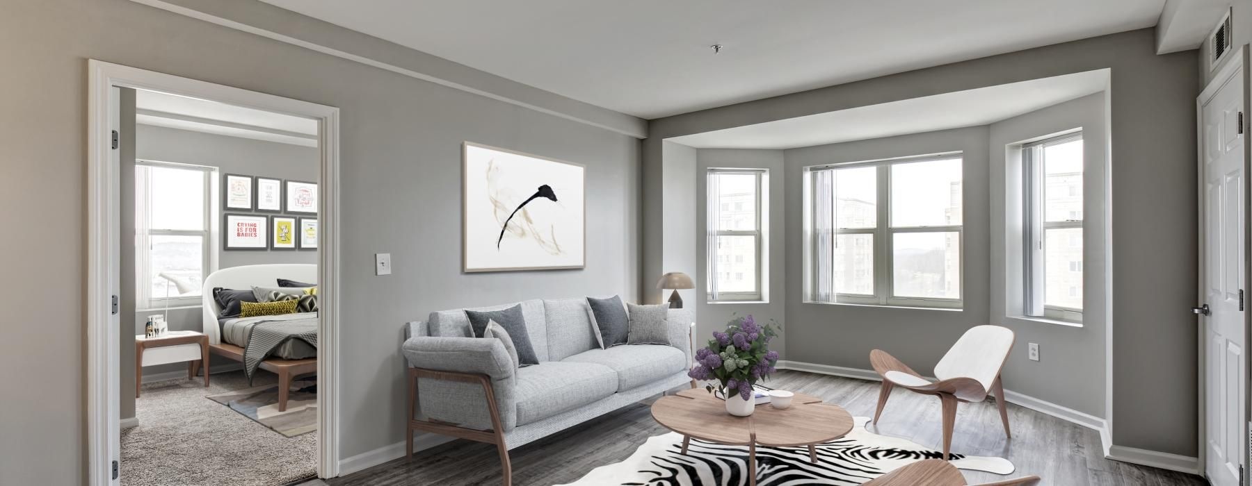 a living room with a couch and chairs