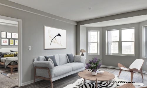 a living room with a couch and chairs
