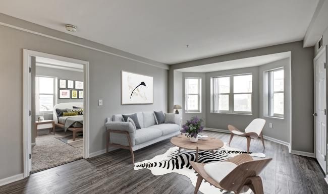 a living room with a couch and chairs