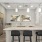 a kitchen with stools and a bar