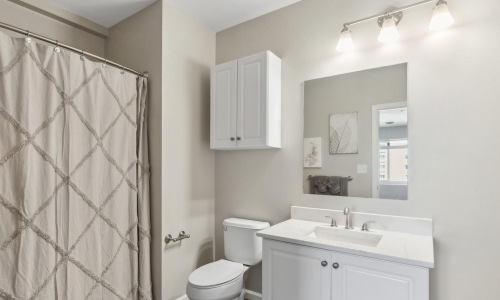 a bathroom with a shower and sink
