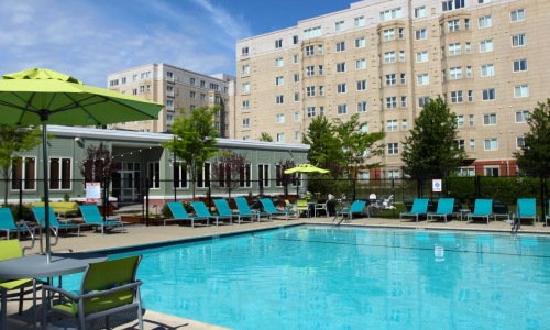 a pool with chairs around it
