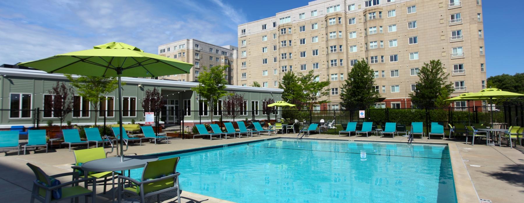 a pool with chairs around it