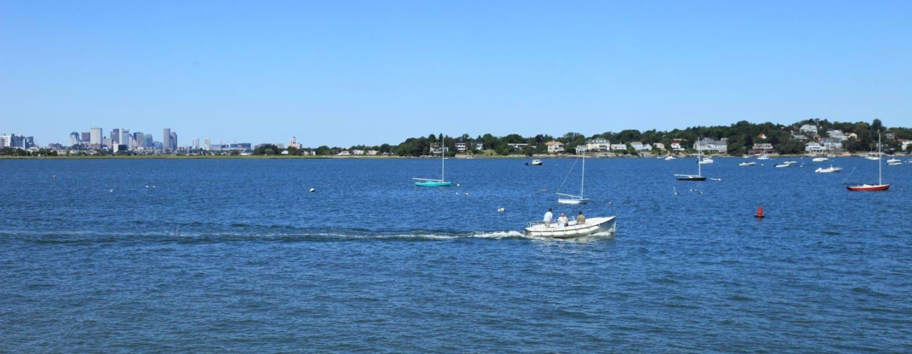 a group of boats on the water