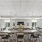 a large dining room with a large table and chairs