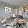 a living room with a dining table and chairs