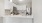 a kitchen with white cabinets