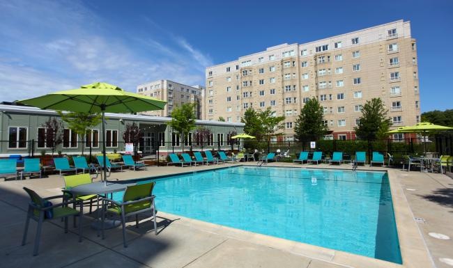 a pool with chairs around it
