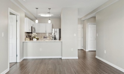 a kitchen with white cabinets
